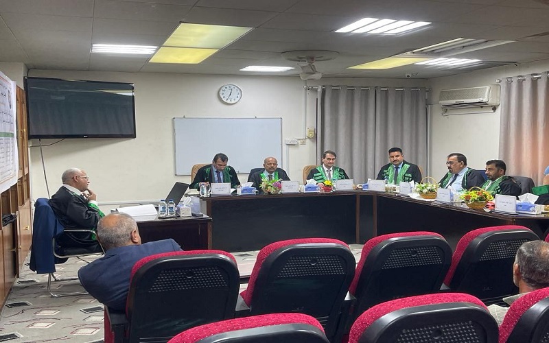 A lecturer  participates in the committee discussing a doctoral dissertation at the University of Basra