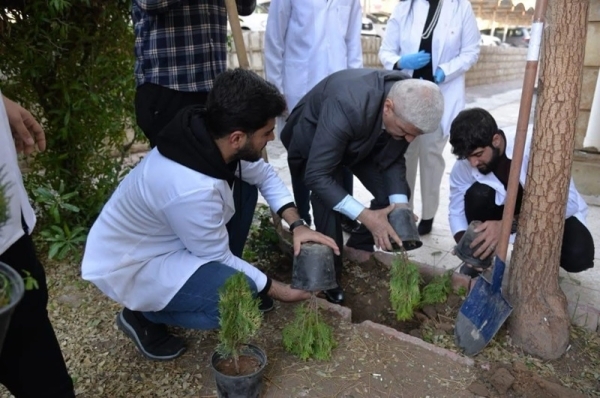 To create a green environment .. The University of Kirkuk continues afforestation campaigns in its faculties