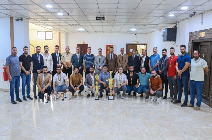 The president of the University of Kirkuk honors the winning team of the University Futsal Championship Cup