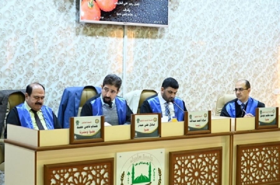 A faculty member from the University of Kirkuk participates in the discussion of a master's thesis at the University of Samarra