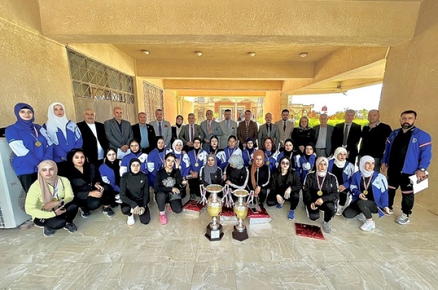 After achieving the championship cup and advanced positions, the university president honors the participating teams in the Iraqi university championships.