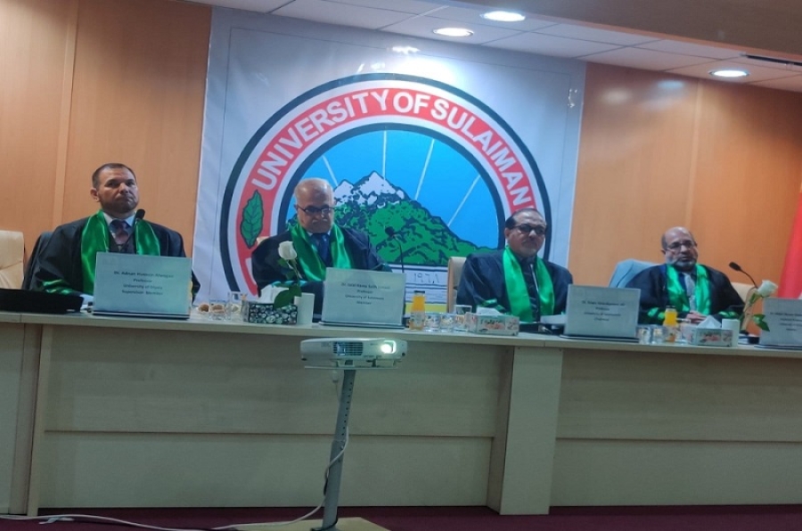 A faculty member from the University of Kirkuk participates in a master's thesis at the University of Sulaymaniyah