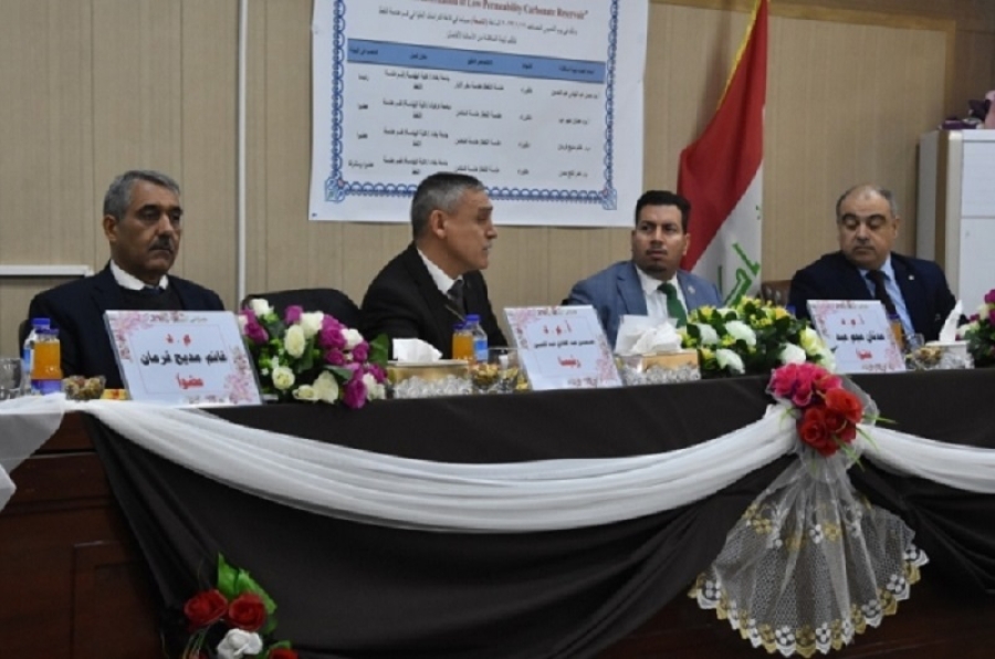 A faculty member from the University of Kirkuk participates in a discussion of a master&#039;s thesis at the University of Baghdad