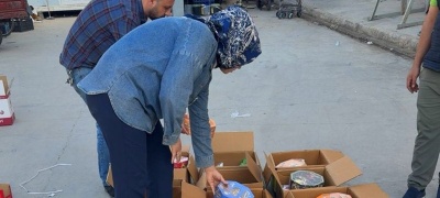 كلية الصيدلة تنظم حملة تطوعية بتوزيع سلات غذائية للعوائل المتعففة