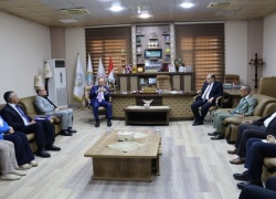 The Dean of the College of Education for Pure Sciences receives the Assistant President of the University for Administrative Affairs