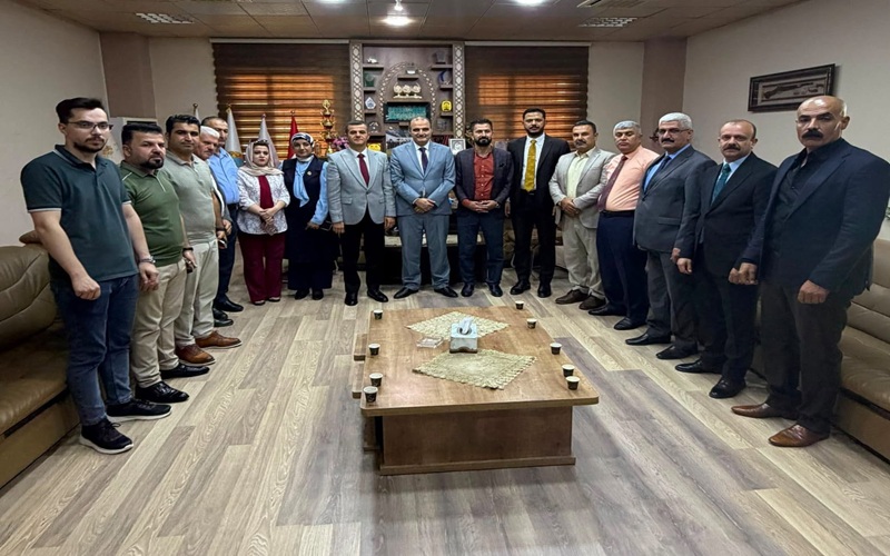 The Dean of the College of Education for Pure Sciences receives an official in the Kurdistan Democratic Party2