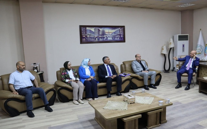 The Dean of the College of Education for Pure Sciences receives the Assistant President of the University for Administrative Affairs2