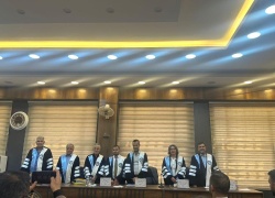 A faculty member at the College of Physical Education and Sports Sciences is participating as a member of a doctoral dissertation committee at the University of Mosul.