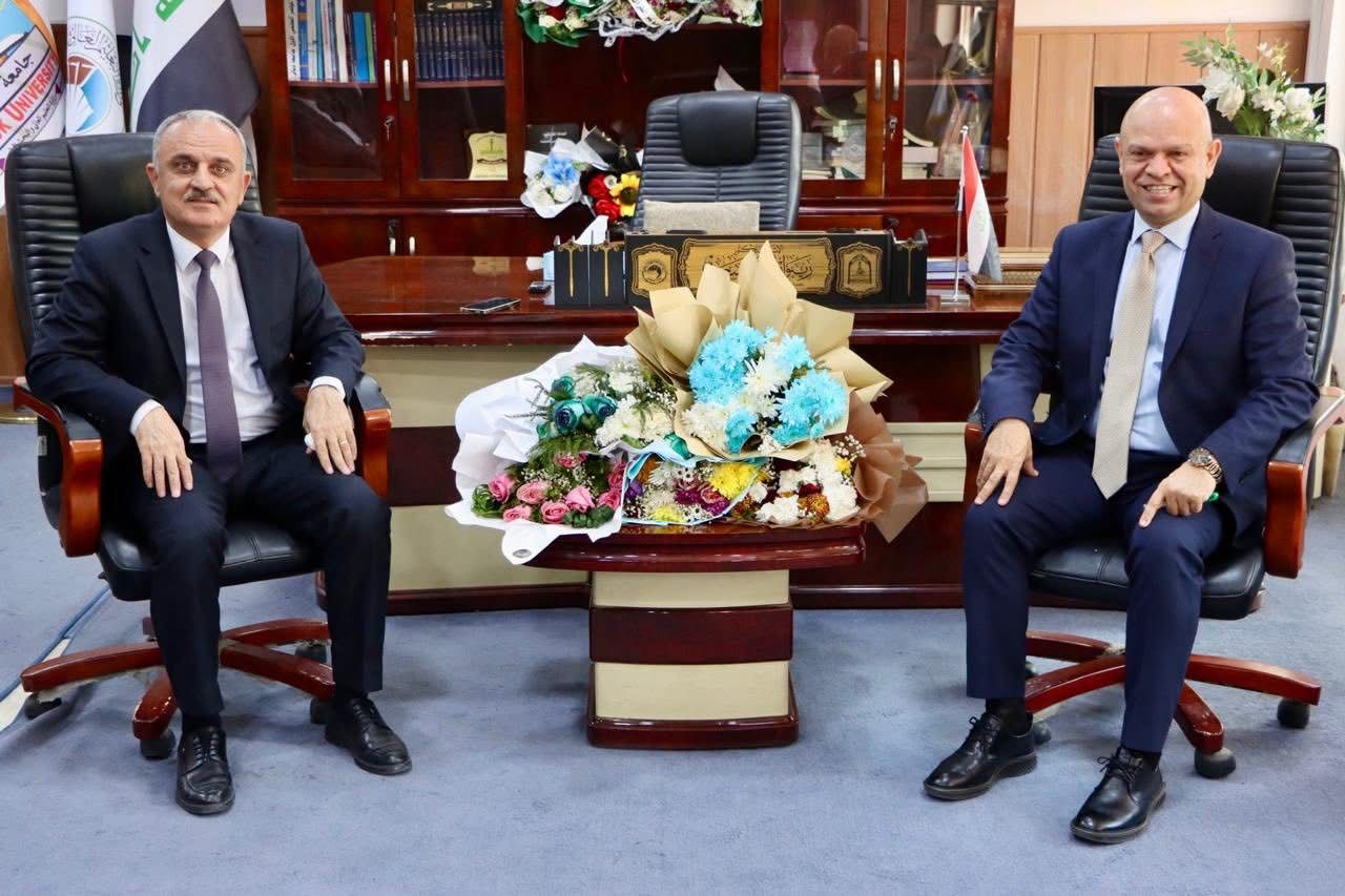 The Dean of the College of Physical Education and Sports Sciences and a number of faculty members congratulate the Assistant President of Kirkuk University for Administrative Affairs on assuming his position.